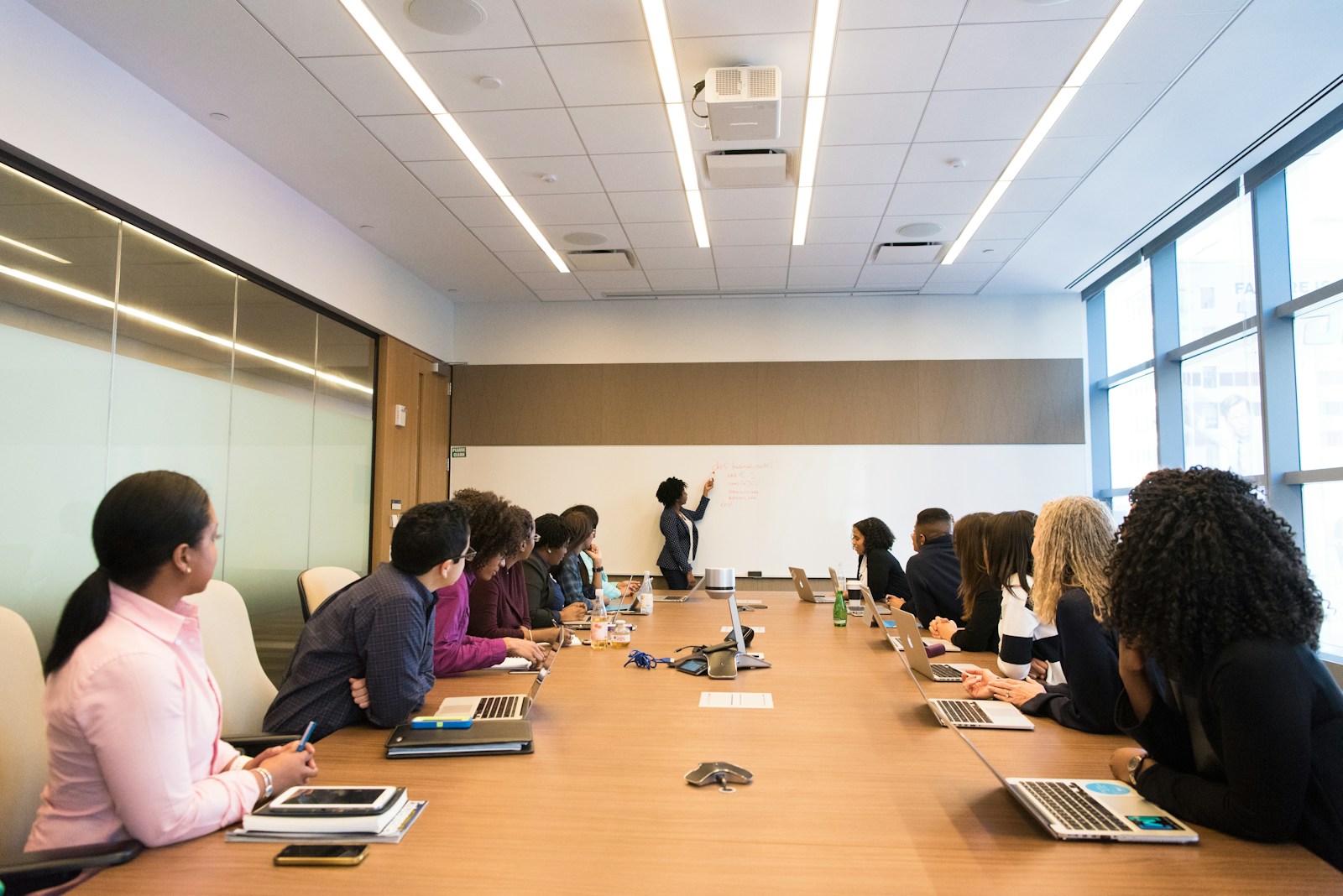 Executives reviewing strategic reports in a boardroom