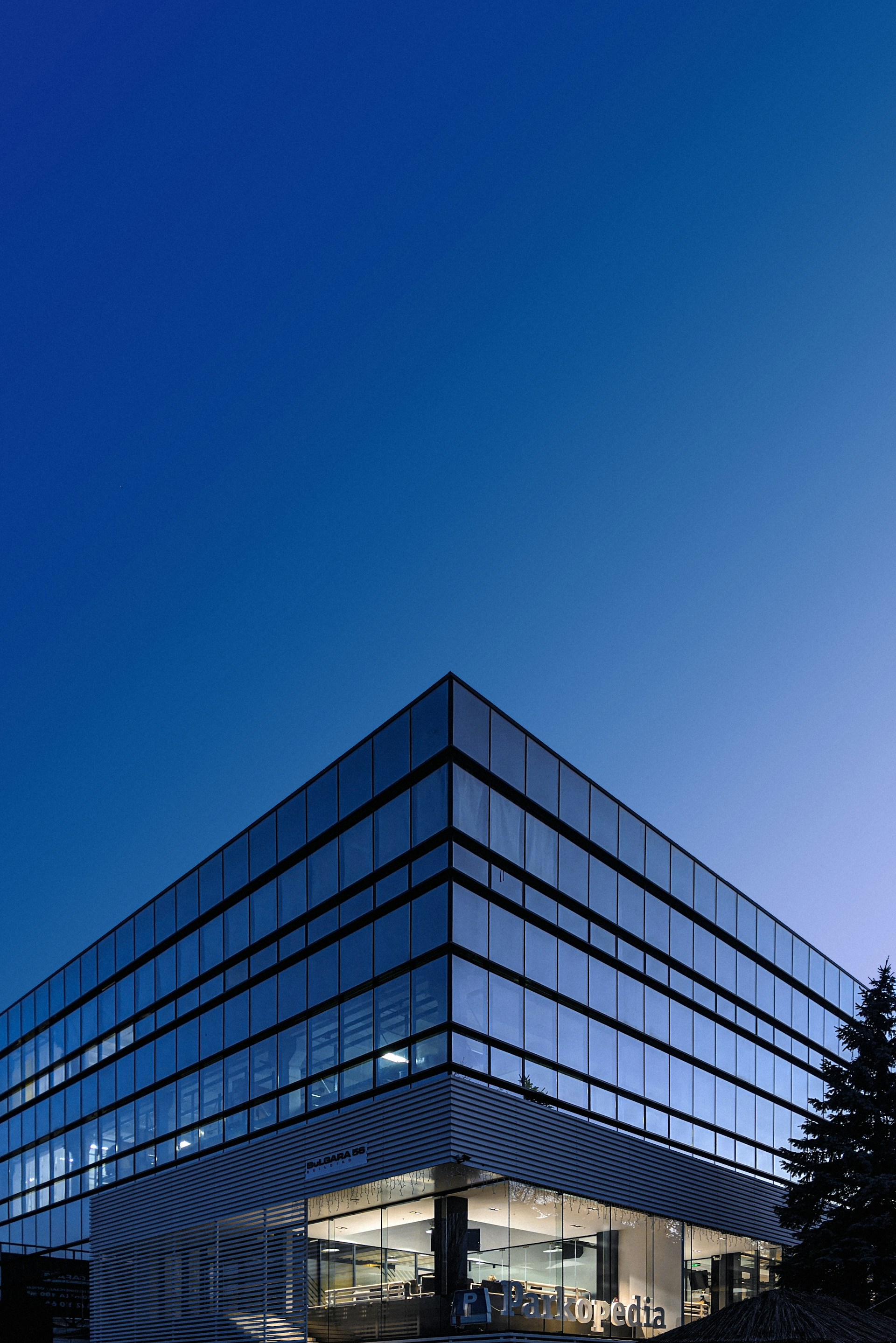 Corporate glass building against a clear Mexico City sky